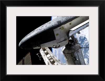 Space Shuttle Discovery docked to the International Space Station