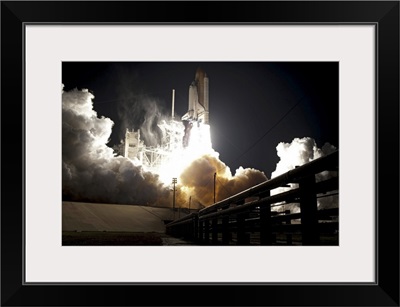 Space shuttle Endeavour lifts off into the night sky from Kennedy Space Center