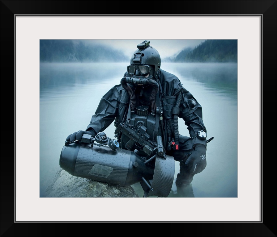 Special operations forces combat diver with underwater propulsion vehicle.