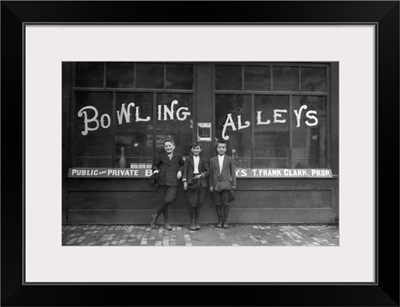 Vintage Photo Of A Row Of Young Boys Posing In Front Of A Bowling Alley Where They Work