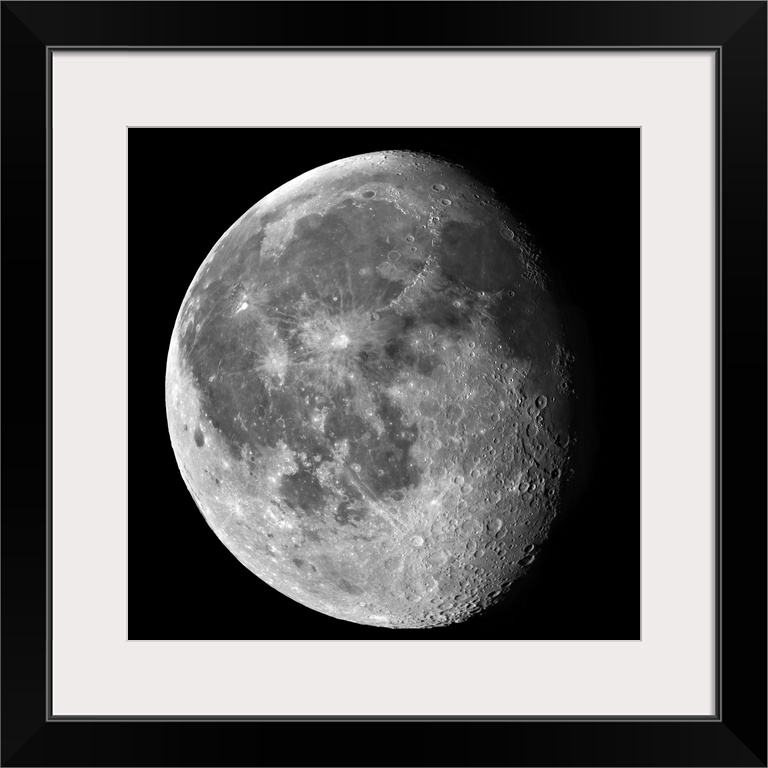 A partially shaded moon is photographed against a black background.