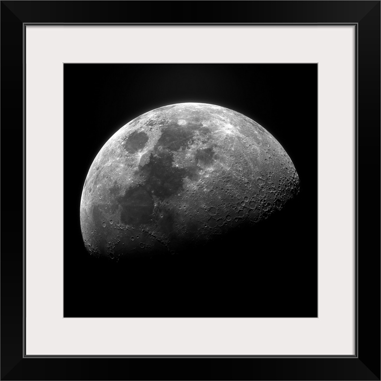 Clear photograph of one of the moon's phases showing well-defined craters, fading to the shadowy dark side.