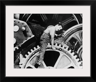 Charlie Chaplin in a scene from the film 'Modern Times,' 1936