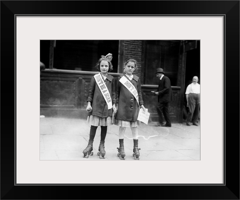 Two young strike sympathizers on rollerskates, probably in New York City. Photograph, c1915.