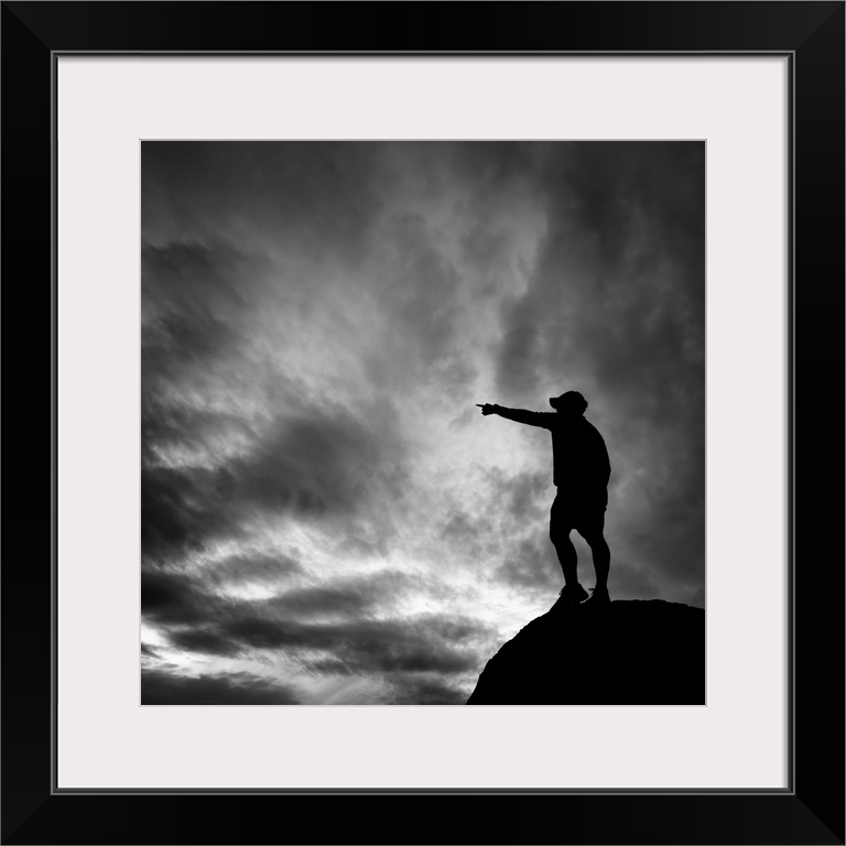 in the sandia mountains of albuquerque new mexico a man points the direction, showing the way towards environmental consid...