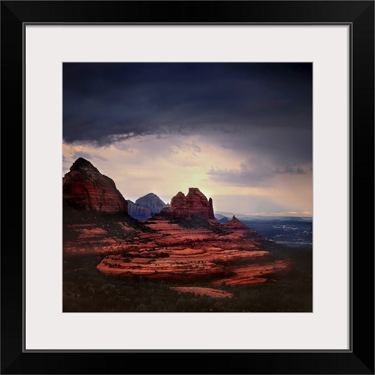 Stormy skies ocer a mountainous landscape