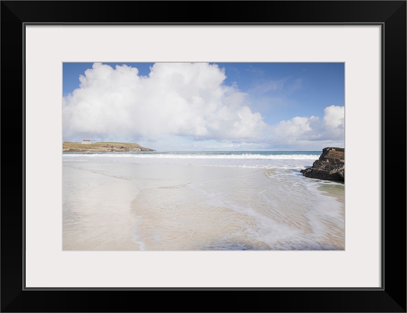 Sunlit beach at Port of Ness, Lewis, Outer Hebrides, Scotland, UK