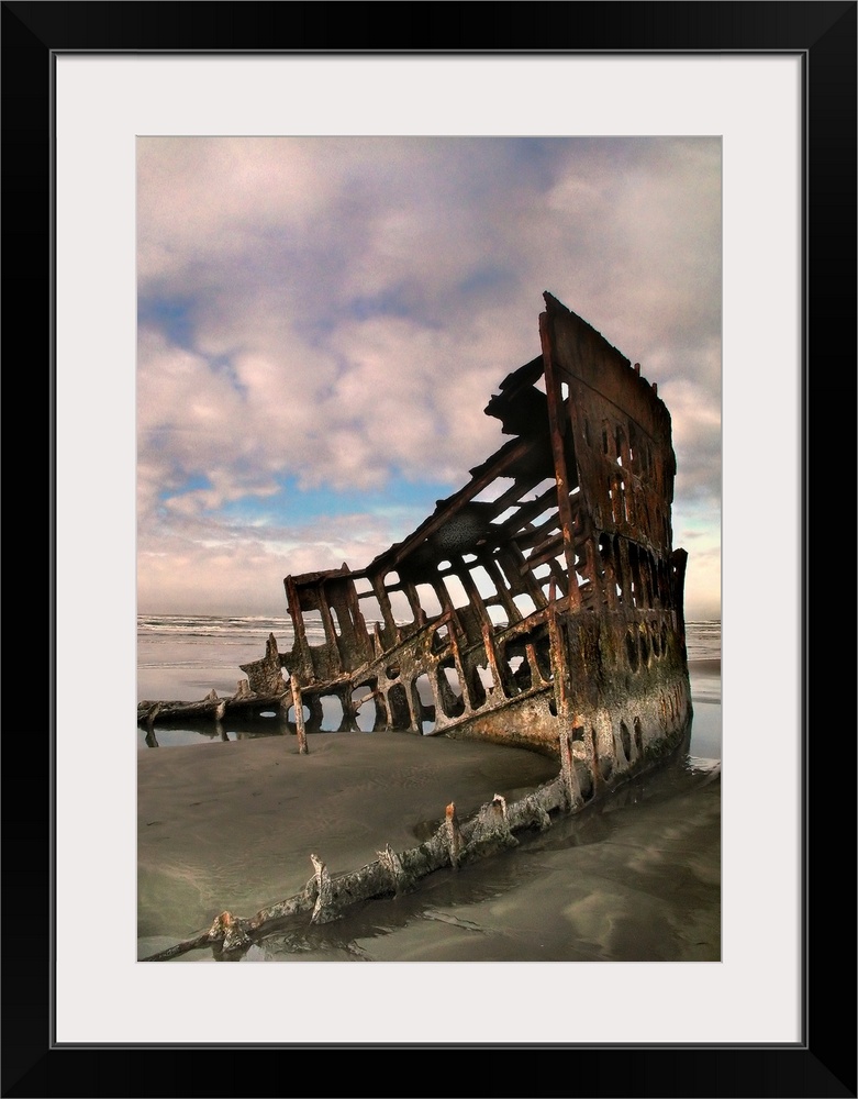 Shipwreck on a beach with rust