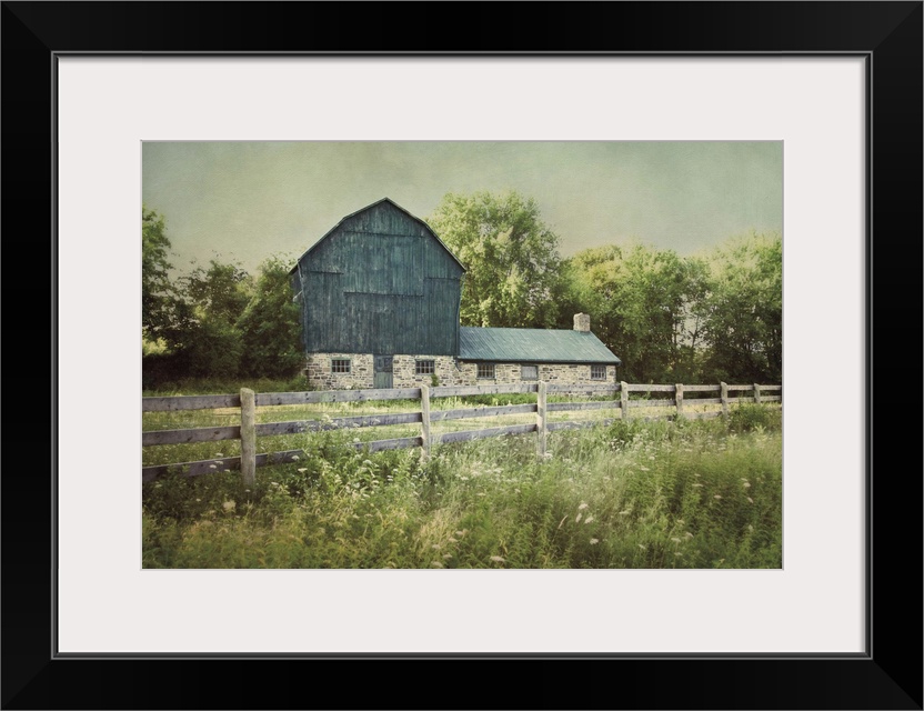 A photograph of a blue barn.