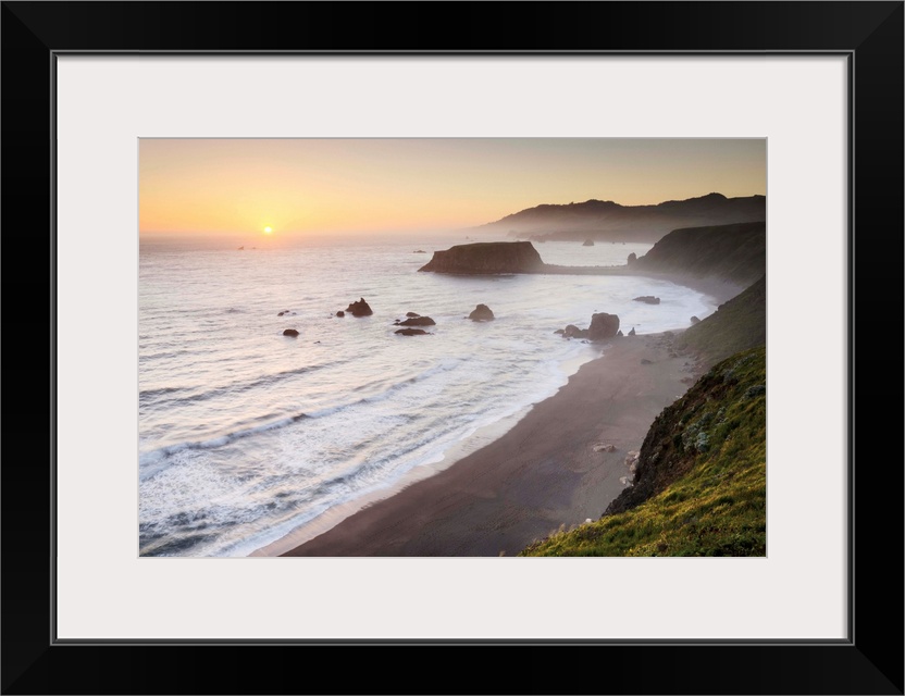 Sunset view of surf beaches and Goat Rock from rugged cliffs and bluffs of Sonoma Coast State Park, California