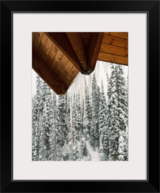 Photograph of icicles hanging from the eaves of a cabin, Emerald Lake Lodge, Banff, Canada