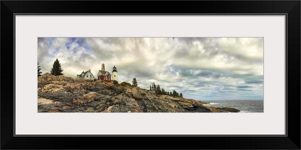 Panoramic photography of Pemaquid Lighthouse on the rocky coast under stunning clouds.