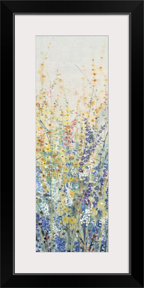 Vertical panel of blooming yellow and blue wildflowers in a field.