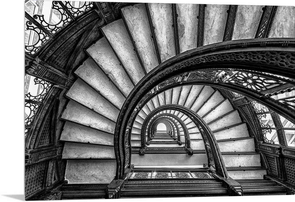 Black and white abstract photograph of a winding staircase.