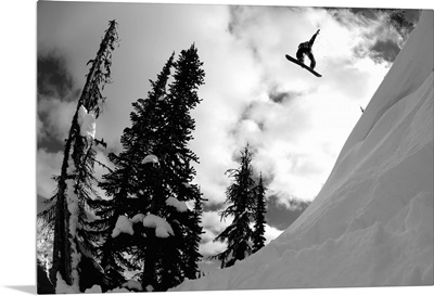 Professional snowboarder makes a big air jump, Canada