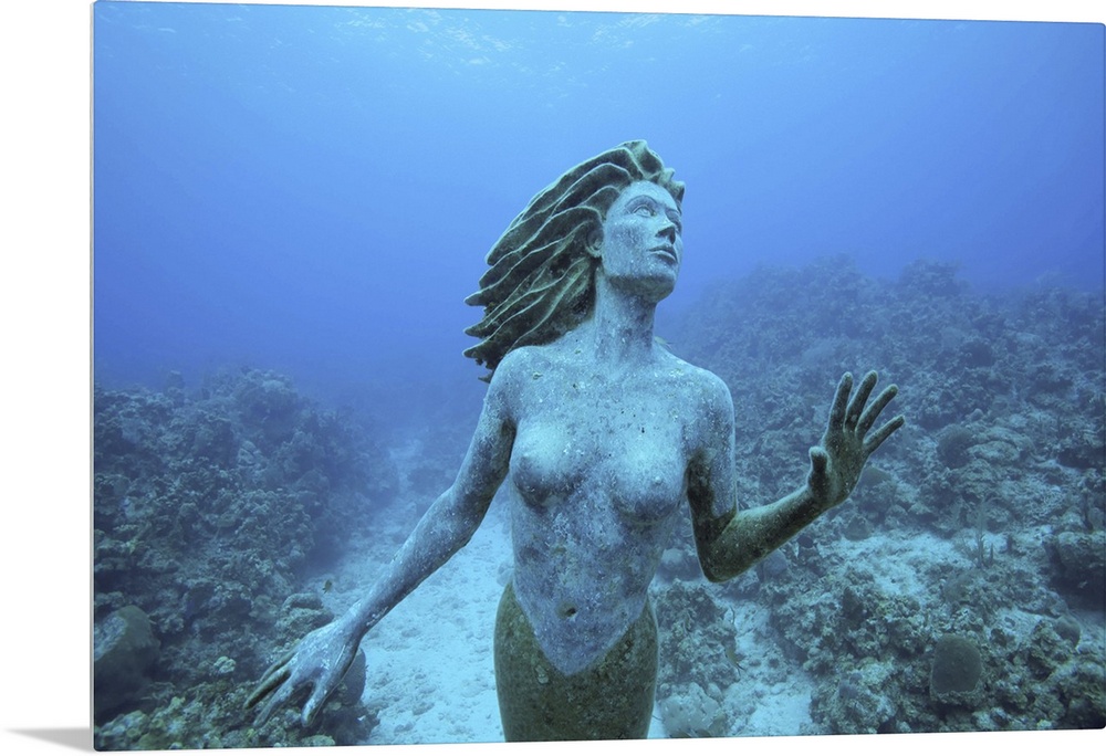 Cayman Islands, Grand Cayman Island, Underwater view mermaid sculpture in shallow coral reefs in Caribbean Sea