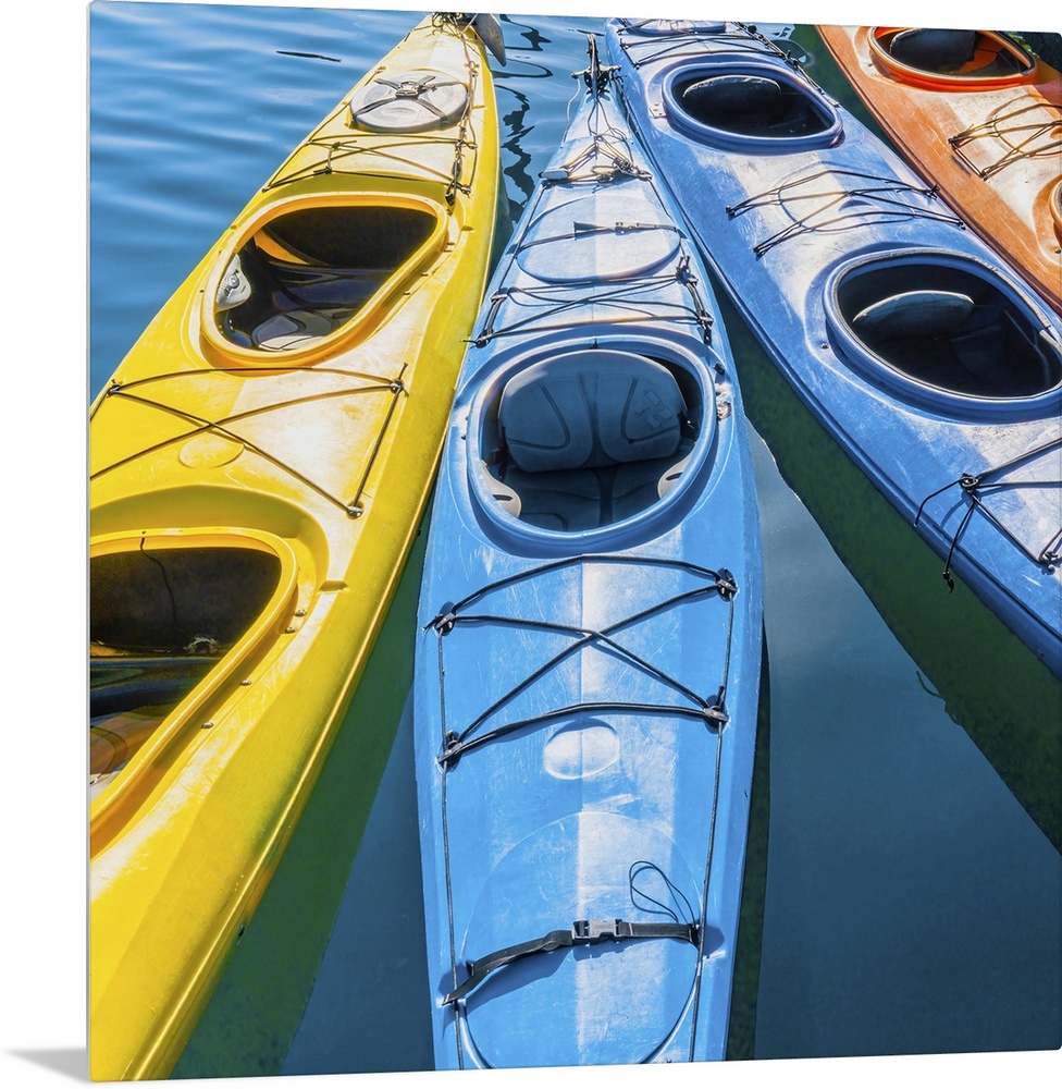 Four Colorful Kayaks Positioned In An Array