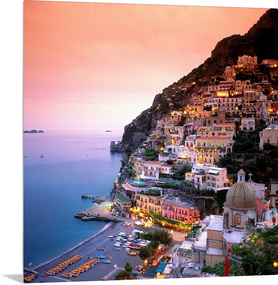 A square shaped photograph of the charming Italian town of Positano at sunset. Built into the cliffs overlooking the Medit...