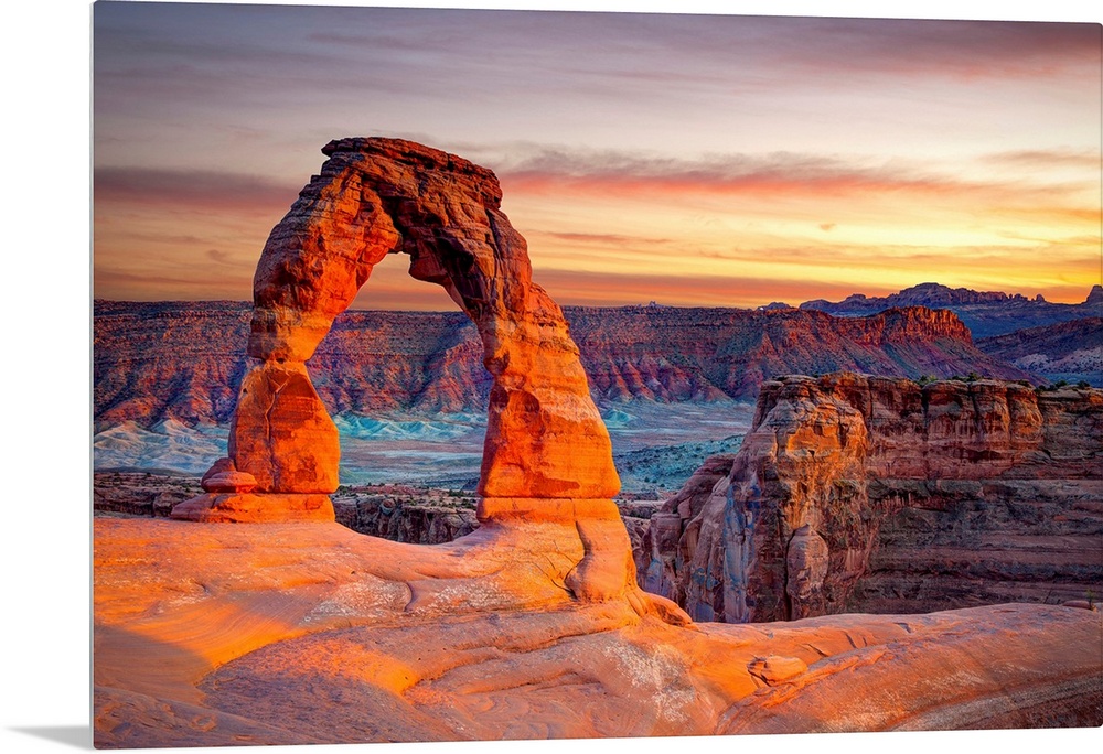 This wall art for the home or office shows desert rock cliffs growing in the light of a sunset.