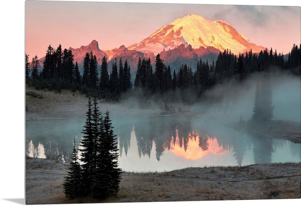 Fine art photo of sunlight hitting the snow peak of Mount Rainier, Washington.