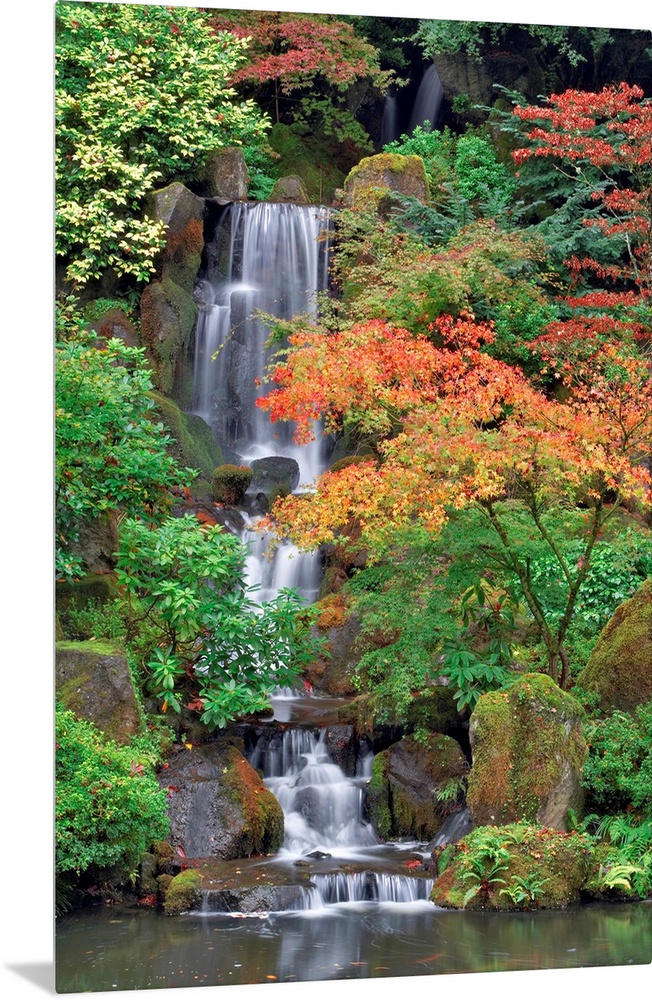 Photograph of waterfall surrounded by autumn trees.