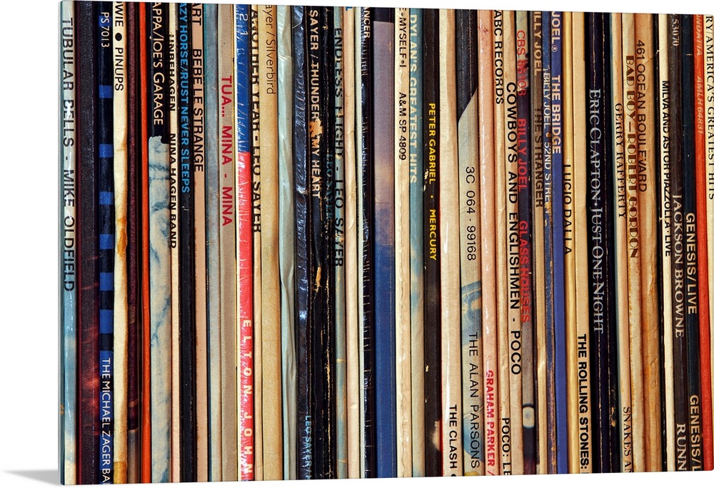 Big photograph shows a large collection of LP vinyl records that includes works from artists such as Eric Clapton, Billy J...