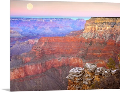 Full moon over the Grand Canyon at sunset as seen from Pima Point Arizona