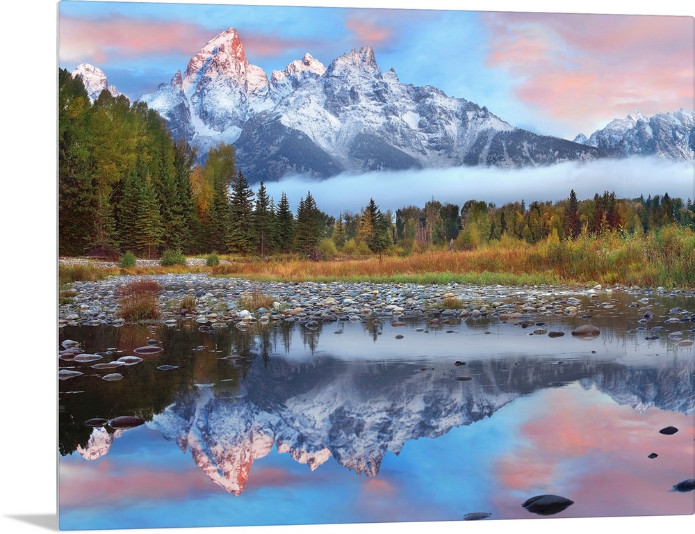 Giant photograph incorporates a large mountain range covered in snow reflecting over a calm body of water surrounded by a ...