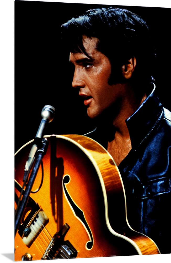 Big canvas photo of an up close shot of Elvis Presley holding a guitar in front of a microphone.