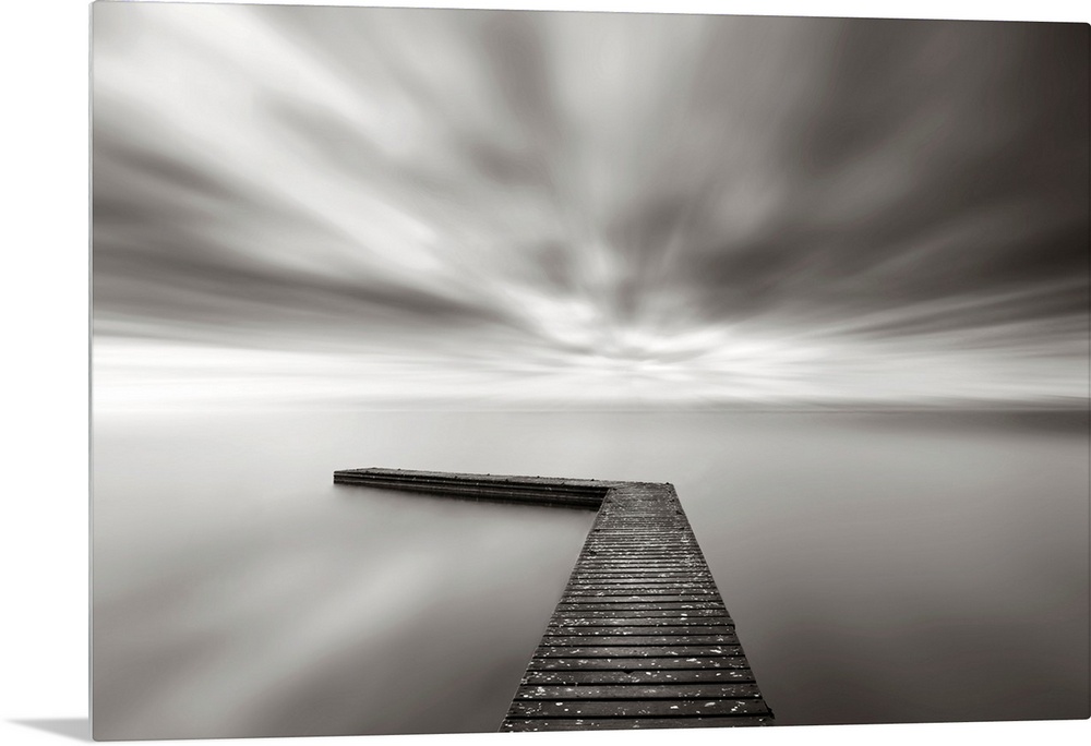 This wall art is a time lapsed photograph of this lake pier has created a sensation of motion in the sky and water which h...