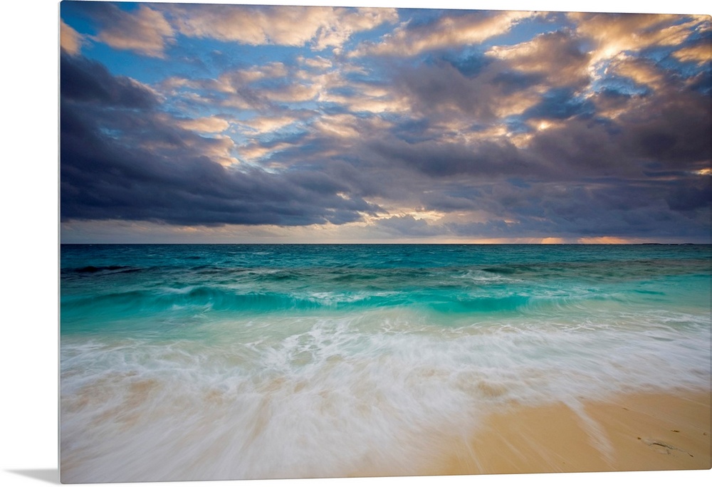A giant photograph of a beach on the Ambergris Cay Island within the Turks and Caicos Islands.  The colorful ocean contras...