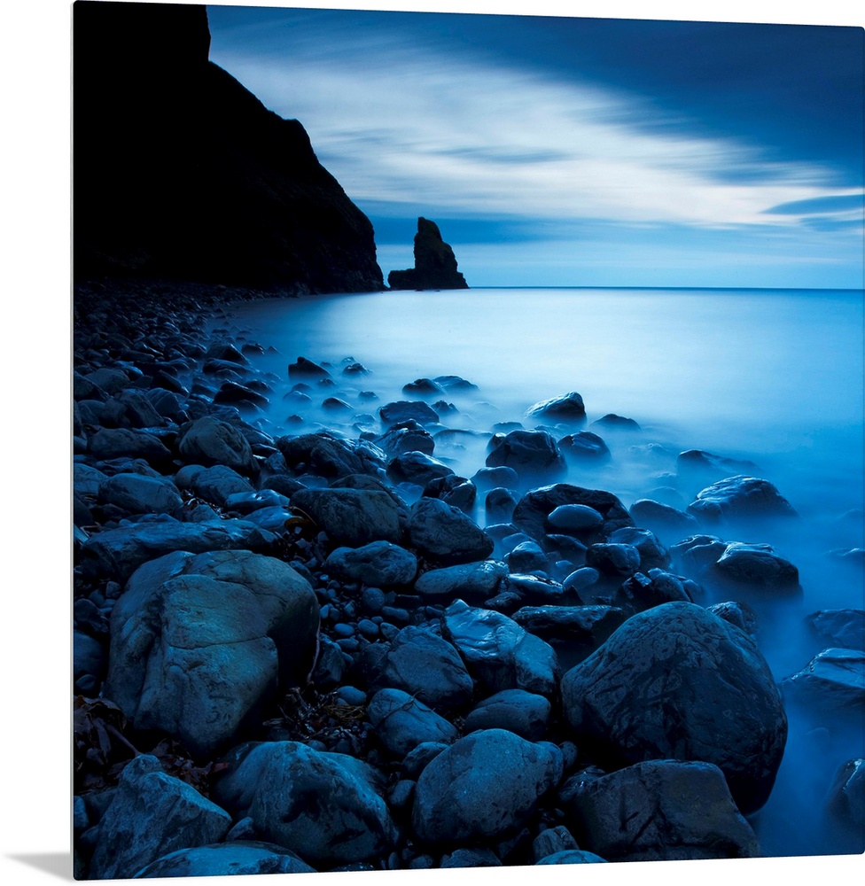 This is a vertical landscape photograph of fog and water on rocky beach that would make great huge wall art for the home o...