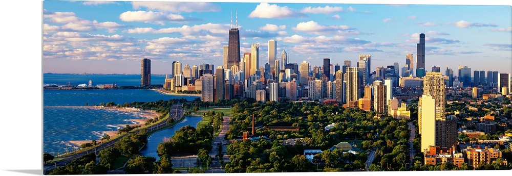 Panoramic photograph taken of the busy skyline of Chicago, Illinois on a sunny day.  The skyscrapers in the background are...