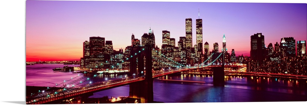 Large artwork for a living room of office of the Brooklyn Bridge and Manhattan with lights shining in the evening sky.