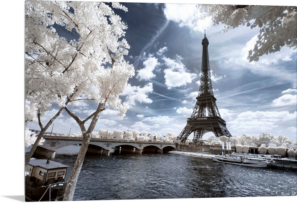 A view of the Eiffel Tower in Paris, made in infrared mode in summer. The vegetation is white and rendering of the sky is ...