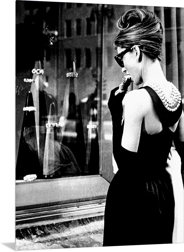 Big photograph showcases a famous Hollywood actress as she stares through an outdoor display case of jewelry.  This Britis...