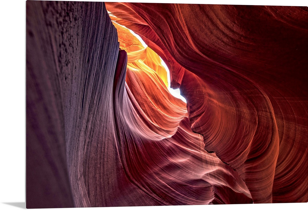 Photograph from inside of Antelope Canyon rock formation located on the Navajo Reservation in Page, Arizona with colorful ...