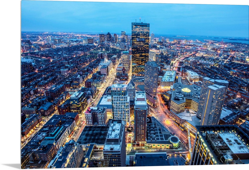 Photo of Boston cityscape at night featuring the John Hancock Tower.