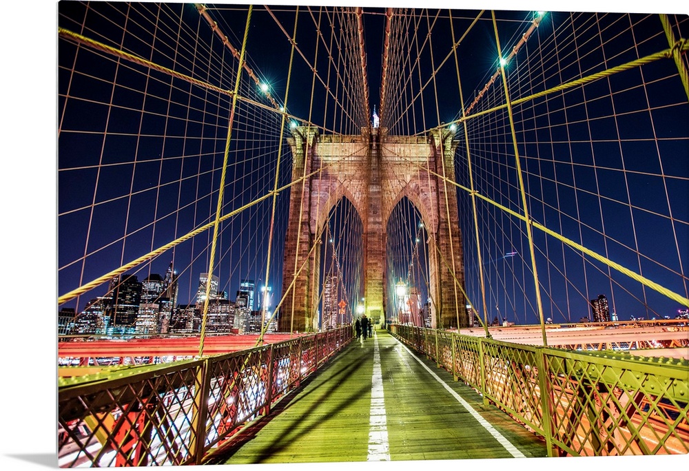 One of the stone piers surrounded by many cables on the Brooklyn Bridge in New York.