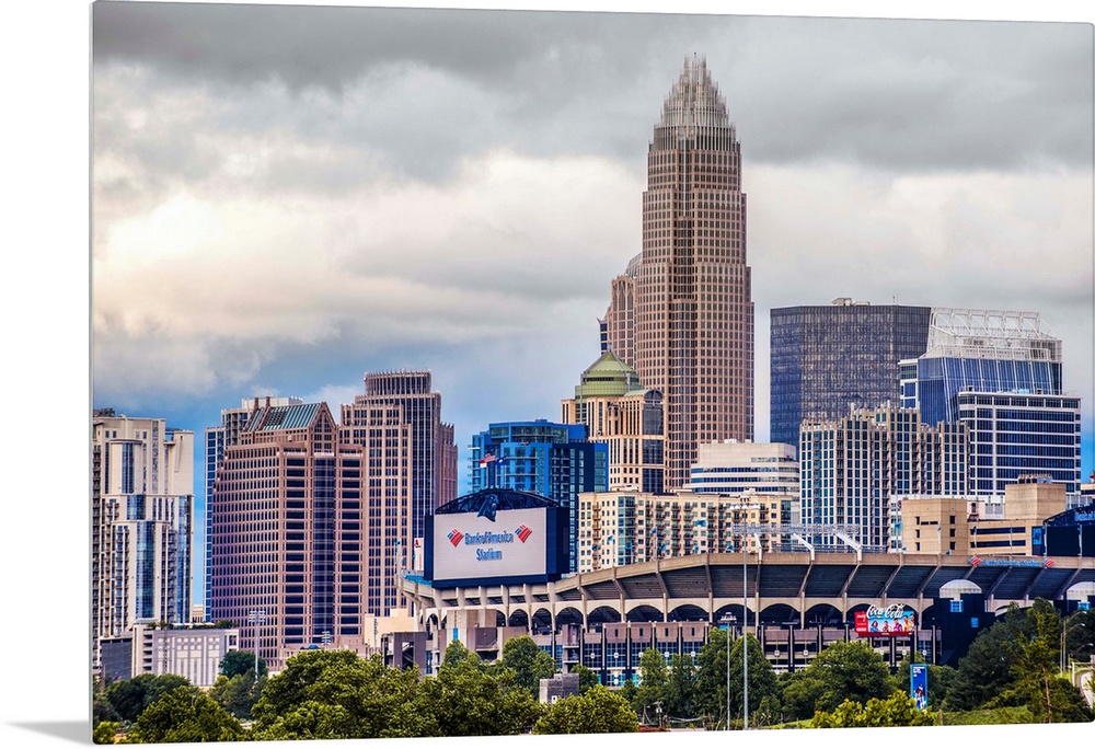 Horizontal image of the city of Charlotte, North Carolina with a cloudy sky.