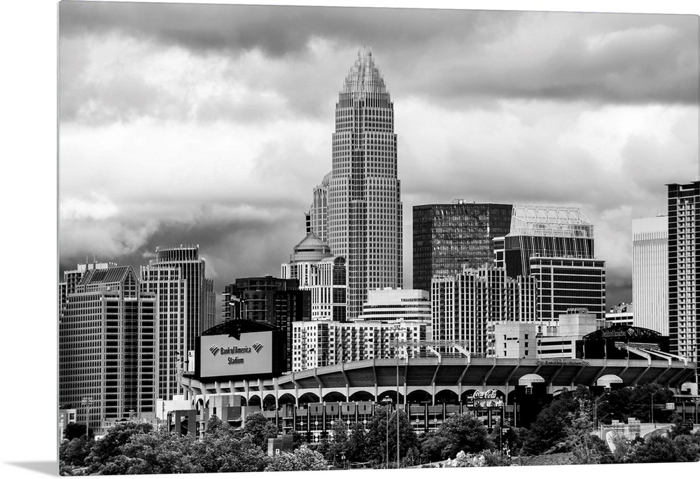 Horizontal image of the city of Charlotte, North Carolina with a cloudy sky.