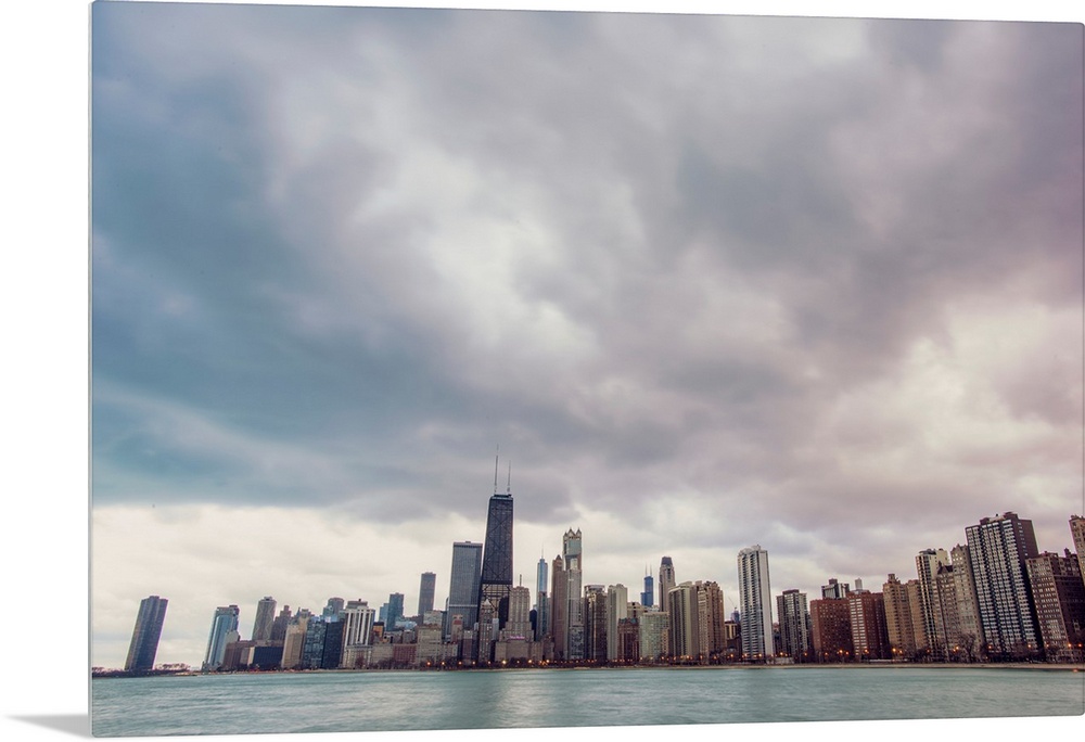 Photo of Chicago's skyline under dramatic clouds.