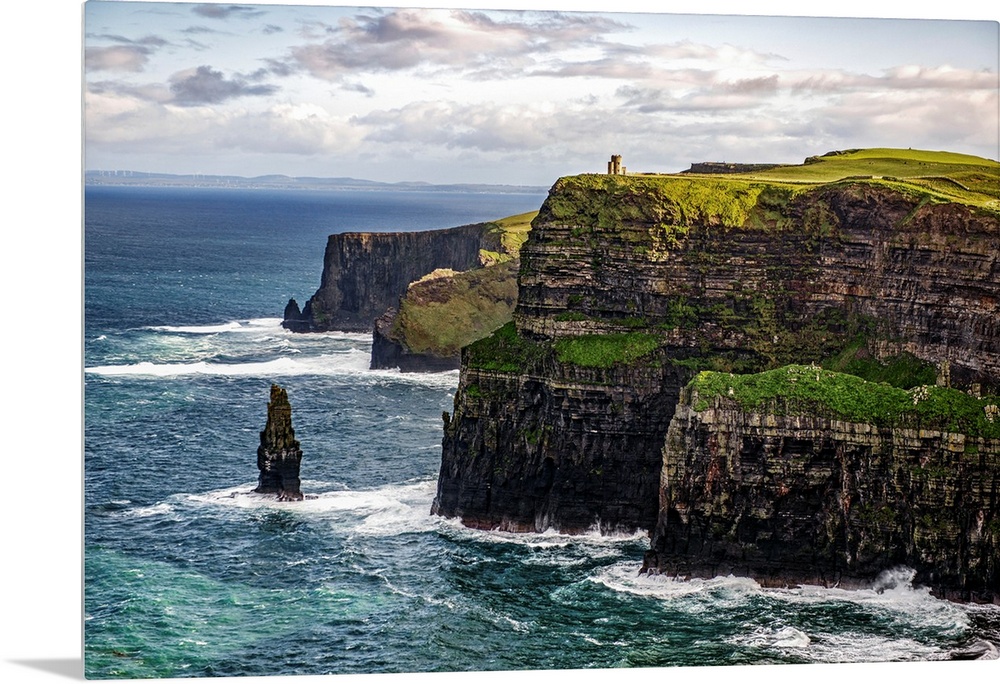 Photograph of the Cliffs of Moher with O'Brien's Tower seen in the distance, marking the highest point of the Cliffs of Mo...