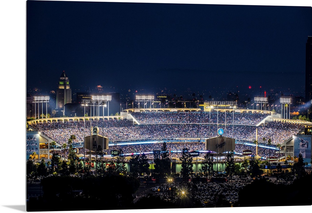 Photograph of Dodger Stadium lit up on a game night.