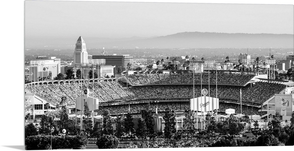 Panoramic photograph of Dodger Stadium lit up on a game night.
