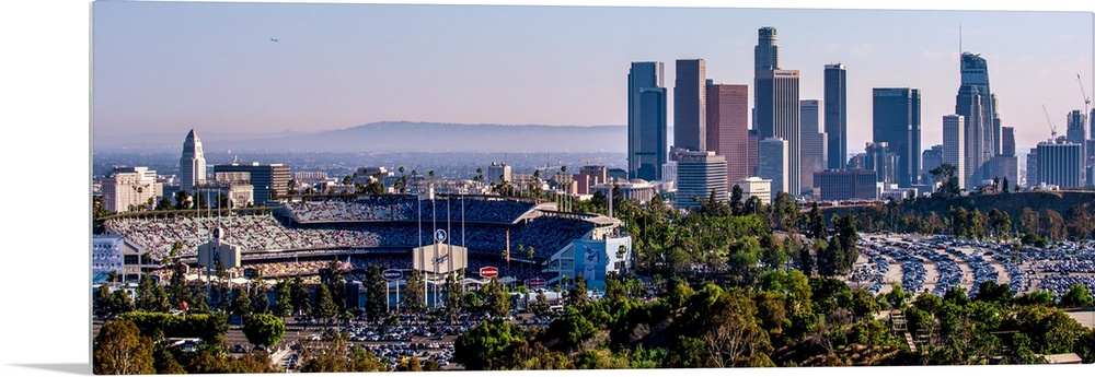 Panoramic photograph of the downtown Los Angeles skyline with Dodger Stadium on the left.