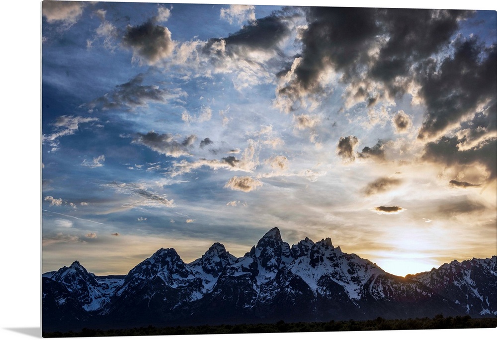 View of dramatic clouds over Teton mountains in Wyoming.