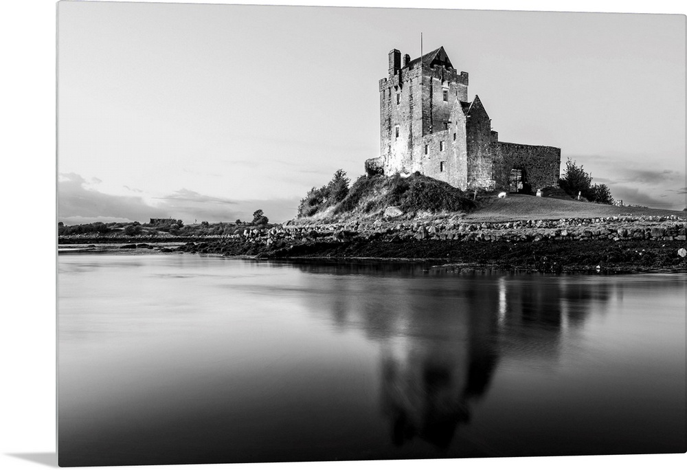 Black and White landscape photograph of the Dunguaire Castle reflecting into the water on the southeastern shore of Galway...