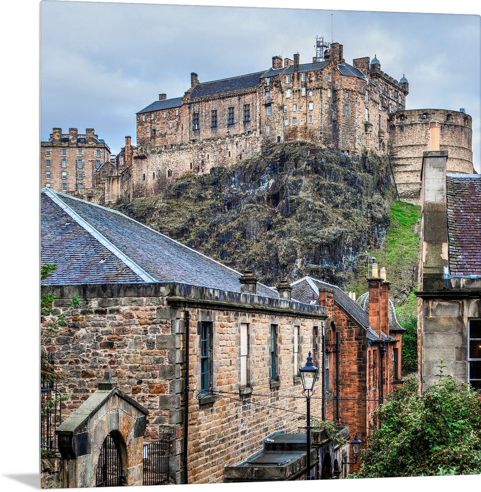 Square photograph of the Edinburgh Castle with old stone buildings in the foreground, Edinburgh, Scotland, UK