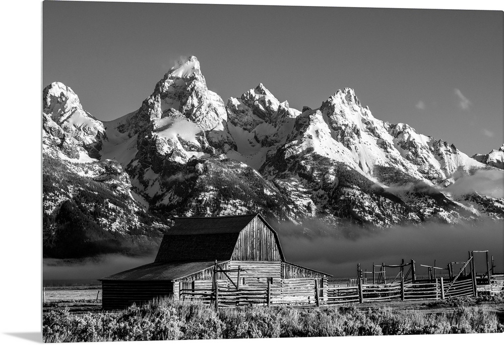 The John Moulton barn sits against a picturesque landscape of the Teton mountain range in Wyoming.